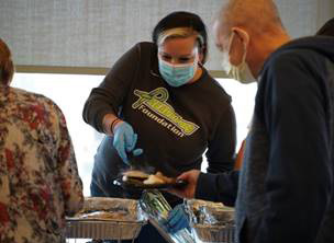 HEADstrong event passing food out